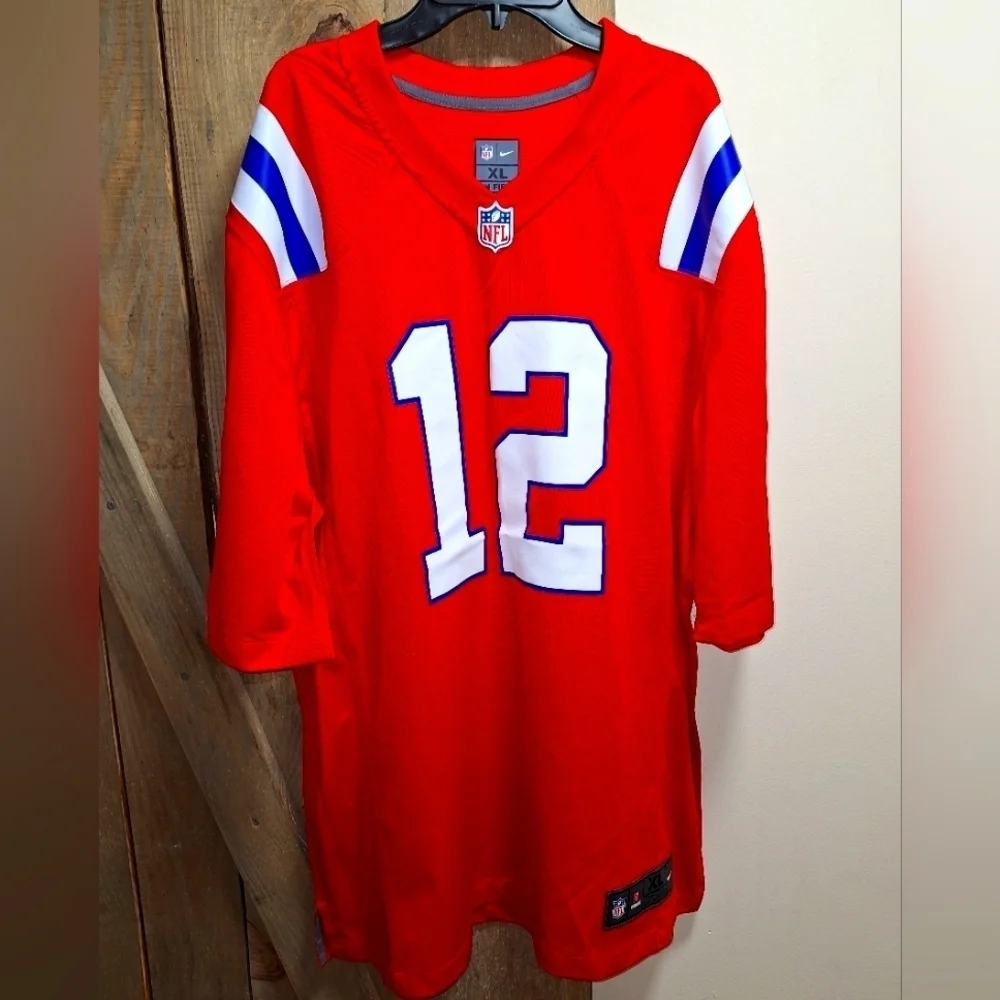 A Nike official NFL #12 Brady jersey in a mens XL and medium. NWOT.